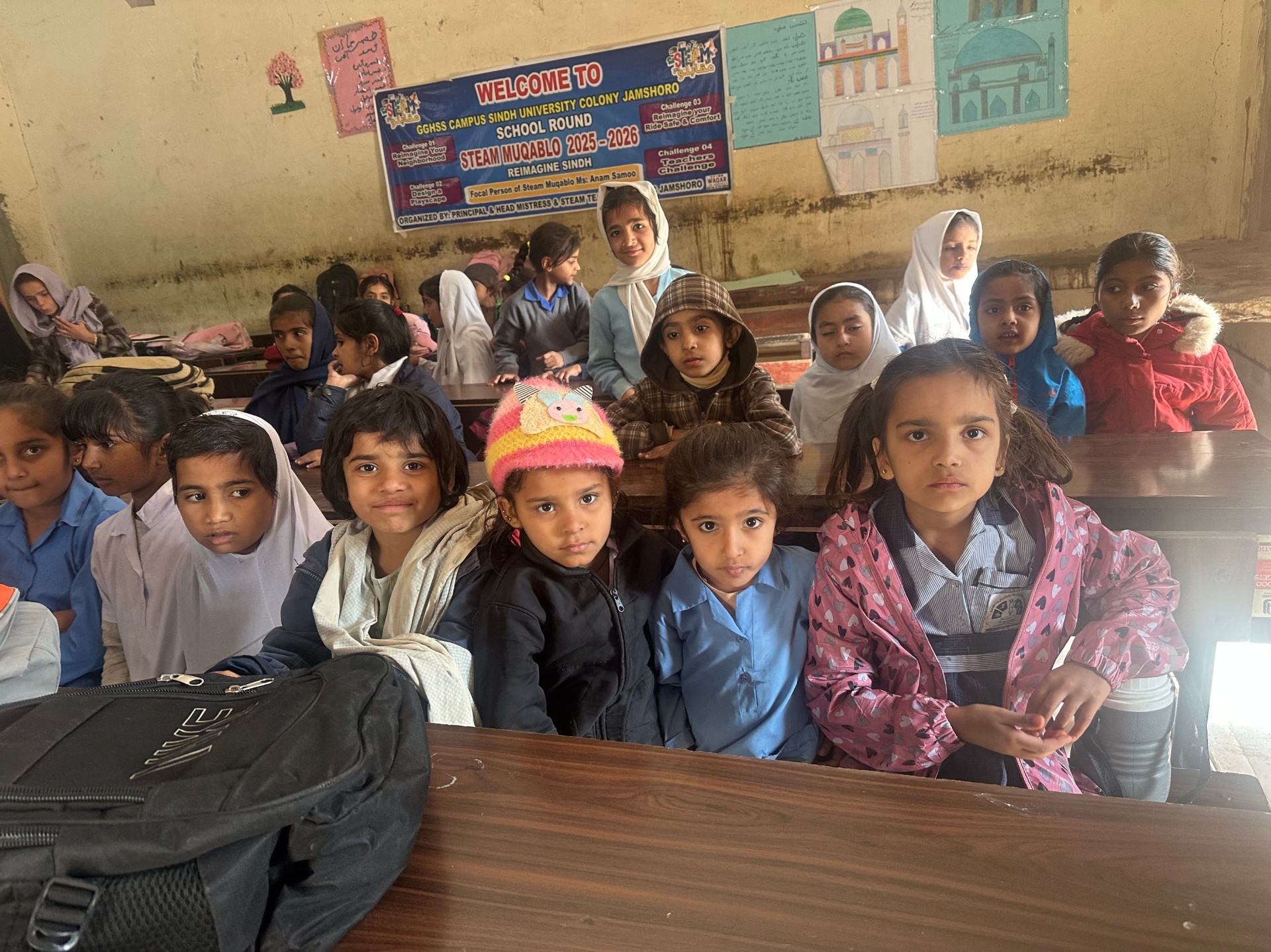 Students at GGHSS Sindh University Colony Jamshoro wait for vision screening