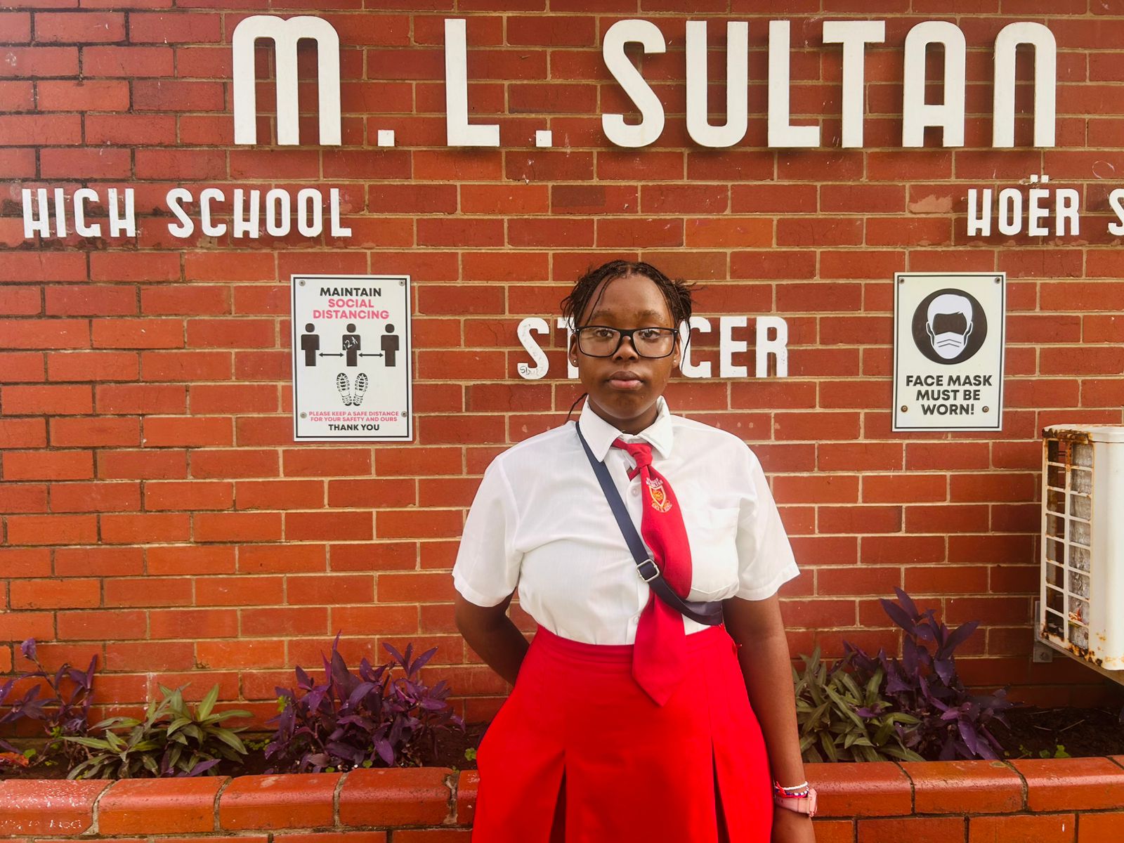 Ayanda, a Grade 10 learner, wearing her new spectacles outside Stanger ML Sultan High School